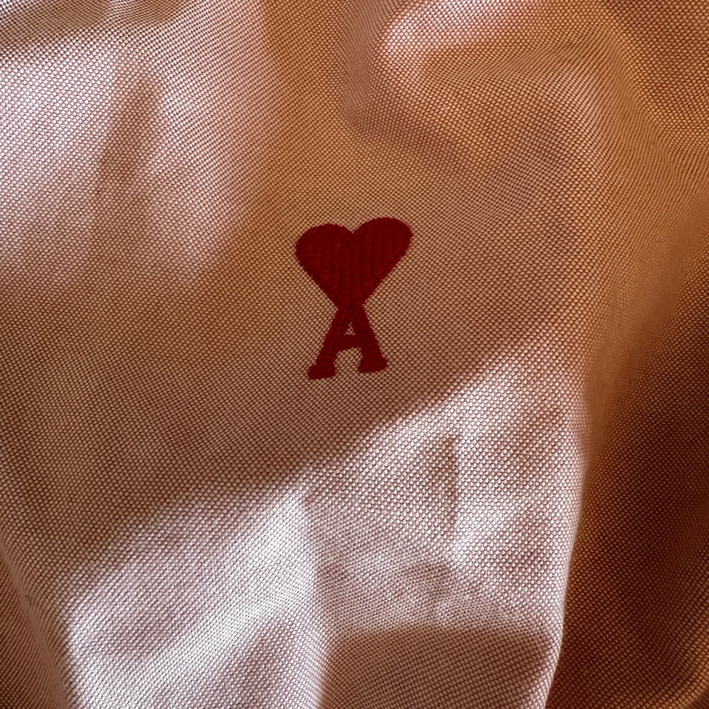 Ami pink button up shirt.